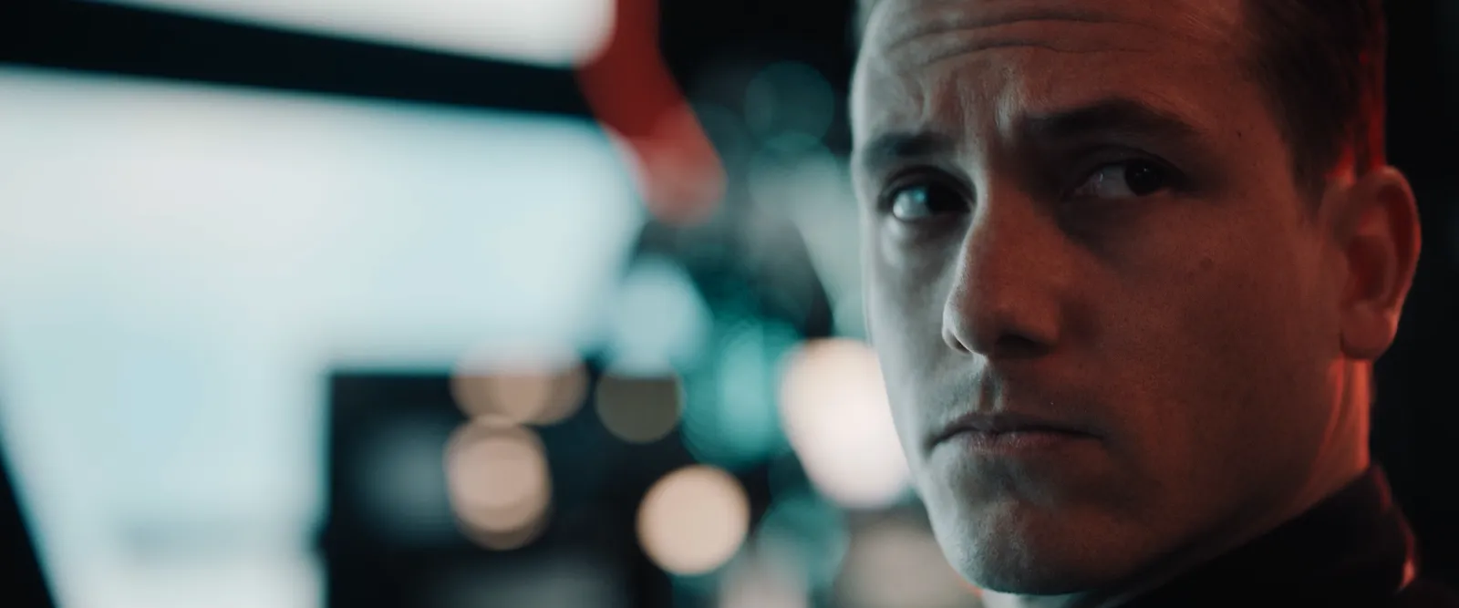 An actor in close-up under studio light